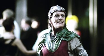 Movie still from “Last Night” (1998), directed by Don McKellar – A person dressed as a medieval knight in a costume; Close Up shot, Low angle