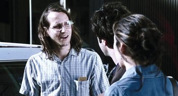 Movie still from “Last Night” (1998), directed by Don McKellar – A group of young people standing next to each other; Medium shot, Over the shoulder angle