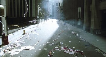Movie still from “Last Night” (1998), directed by Don McKellar – A city street filled with lots of garbage; Extreme Wide shot, High angle