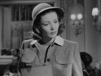 Movie still from “Laura” (1944), directed by Rouben Mamoulian – A black and white photo of a woman wearing a hat; Close Up shot, High angle