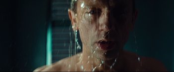 Movie still from “Layer Cake” (2004), directed by Matthew Vaughn – A person in a shower; Close Up shot, Low angle