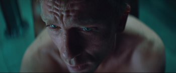 Movie still from “Layer Cake” (2004), directed by Matthew Vaughn – A man's face with blue eyes; Close Up shot, Overhead angle