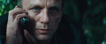 Movie still from “Layer Cake” (2004), directed by Matthew Vaughn – A person with blue eyes; Close Up shot, Over the shoulder angle
