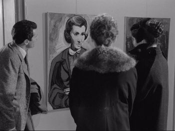 Movie still from “The Girlfriends” (1955), directed by Michelangelo Antonioni – A group of people looking at a painting of a woman; Medium shot, Over the shoulder angle