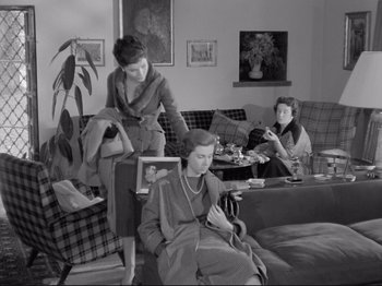 Movie still from “The Girlfriends” (1955), directed by Michelangelo Antonioni – A group of women sitting in a living room together; Wide shot, High angle