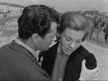Movie still from “The Girlfriends” (1955), directed by Michelangelo Antonioni – A man and a woman looking at one another; Medium shot, Over the shoulder angle