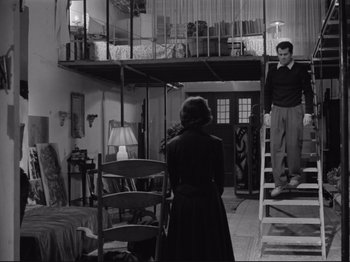 Movie still from “The Girlfriends” (1955), directed by Michelangelo Antonioni – A man and a woman standing in front of a doorway; Wide shot, Low angle