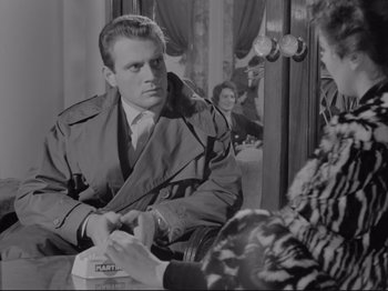 Movie still from “The Girlfriends” (1955), directed by Michelangelo Antonioni – A black and white photo of a man and a woman; Medium shot, Over the shoulder angle