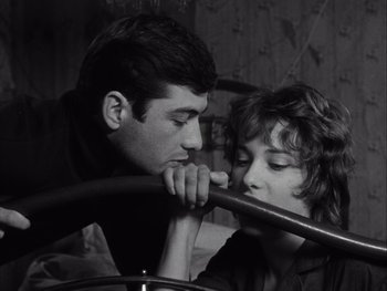 Movie still from “Le Beau Serge” (1958), directed by Claude Chabrol – A man and a woman leaning on each other's shoulder; Close Up shot, High angle