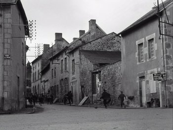 Movie still from “Le Beau Serge” (1958), directed by Claude Chabrol – A black and white photo of a city street; Extreme Wide shot, High angle