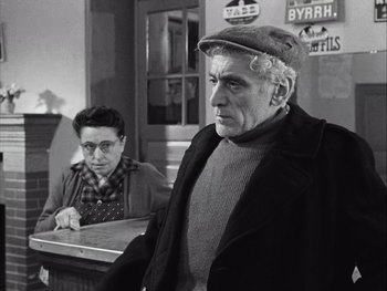 Movie still from “Le Beau Serge” (1958), directed by Claude Chabrol – An older man and a woman in a restaurant; Medium shot, Over the shoulder angle