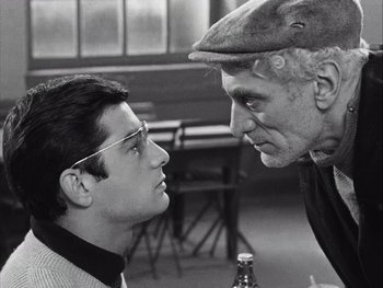 Movie still from “Le Beau Serge” (1958), directed by Claude Chabrol – A man and a woman face to face in a black and white photo; Close Up shot, Over the shoulder angle