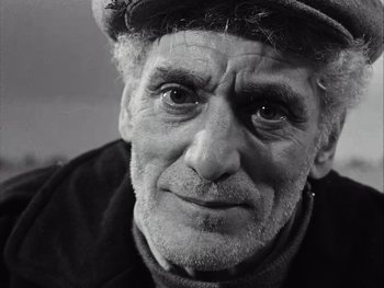 Movie still from “Le Beau Serge” (1958), directed by Claude Chabrol – An older man with a hat and a beard; Close Up shot, Low angle