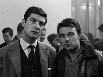 Movie still from “Le Beau Serge” (1958), directed by Claude Chabrol – Two men in suits and ties standing next to each other; Close Up shot, Low angle