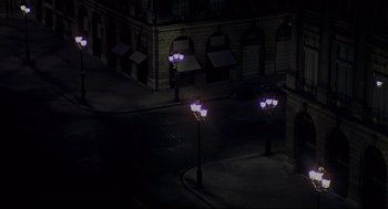 Movie still from “The Red Circle” (1970), directed by Jean-Pierre Melville – A view of street lights at night from above; Extreme Wide shot, High angle
