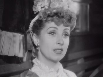 Movie still from “Le Plaisir” (1952), directed by Max Ophüls – A black - and - white photo of a woman in a hat; Close Up shot, High angle