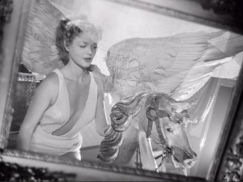 Movie still from “Le Plaisir” (1952), directed by Max Ophüls – A black - and - white photo of a woman and a horse; Medium shot, Low angle