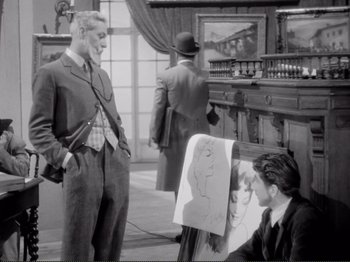 Movie still from “Le Plaisir” (1952), directed by Max Ophüls – A man standing in front of an easel drawing a picture; Medium shot, Over the shoulder angle