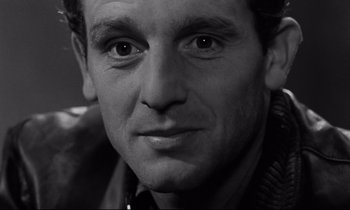 Movie still from “The Hole” (1960), directed by Jacques Becker – Black and white photograph of a man's face; Close Up shot, High angle