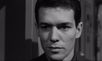 Movie still from “The Hole” (1960), directed by Jacques Becker – Black and white photograph of a young man's face; Close Up shot, Low angle