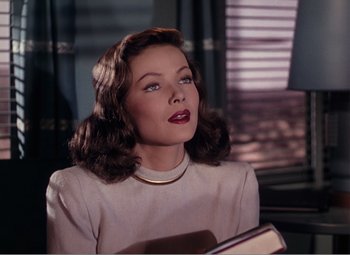 Movie still from “Leave Her to Heaven” (1945), directed by John M. Stahl – A beautiful woman with a book in her hands; Close Up shot, Low angle
