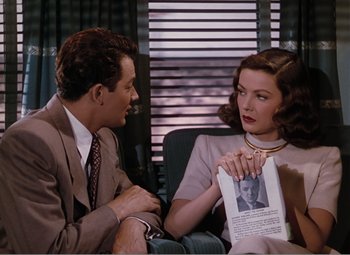 Movie still from “Leave Her to Heaven” (1945), directed by John M. Stahl – A man and a woman sitting on a couch; Medium shot, High angle