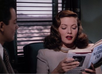 Movie still from “Leave Her to Heaven” (1945), directed by John M. Stahl – A man and a woman sitting in front of each other; Medium shot, Over the shoulder angle