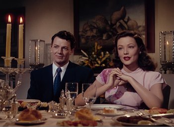 Movie still from “Leave Her to Heaven” (1945), directed by John M. Stahl – A man and a woman sitting at a dinner table; Medium shot, Over the shoulder angle