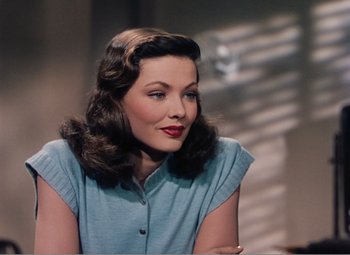 Movie still from “Leave Her to Heaven” (1945), directed by John M. Stahl – A beautiful woman with long brown hair sitting in front of a window; Close Up shot, Over the shoulder angle