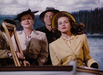 Movie still from “Leave Her to Heaven” (1945), directed by John M. Stahl – A group of people standing next to each other; Medium shot, Low angle