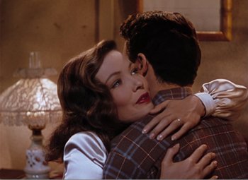Movie still from “Leave Her to Heaven” (1945), directed by John M. Stahl – A man and a woman embracing each other; Medium shot, Over the shoulder angle