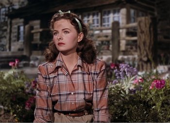 Movie still from “Leave Her to Heaven” (1945), directed by John M. Stahl – A woman in a plaid shirt and a bow tie; Medium shot, Low angle