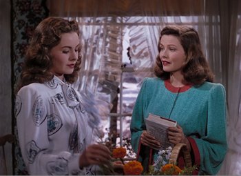 Movie still from “Leave Her to Heaven” (1945), directed by John M. Stahl – Two women standing next to each other in front of a window; Medium shot, Over the shoulder angle