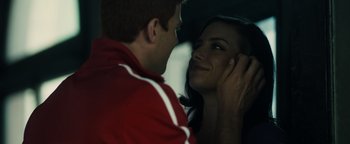 Movie still from “Whiplash” (2014), directed by Damien Chazelle – A man and a woman looking into each others eyes; Close Up shot, Low angle