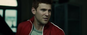 Movie still from “Whiplash” (2014), directed by Damien Chazelle – A person wearing a red jacket; Close Up shot, Over the shoulder angle