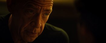 Movie still from “Whiplash” (2014), directed by Damien Chazelle – A person looking at the camera; Close Up shot, Low angle