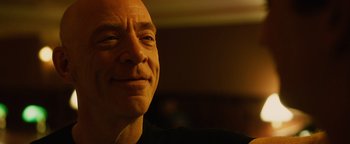 Movie still from “Whiplash” (2014), directed by Damien Chazelle – A man's face in the dark; Close Up shot, Over the shoulder angle