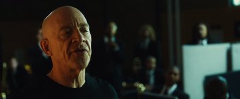Movie still from “Whiplash” (2014), directed by Damien Chazelle – An old man with a bald head is looking at the camera; Close Up shot, Low angle