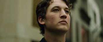 Movie still from “Whiplash” (2014), directed by Damien Chazelle – A person looking up at the sky; Close Up shot, Low angle