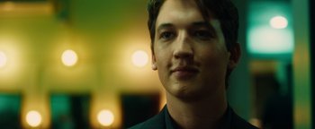 Movie still from “Whiplash” (2014), directed by Damien Chazelle – A young man's face in front of a blurry background; Close Up shot, Low angle