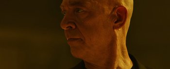 Movie still from “Whiplash” (2014), directed by Damien Chazelle – An old man with a bald head looking to his left; Close Up shot, Low angle