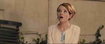 Movie still from “Legend” (2015), directed by Brian Helgeland – A woman with a surprised look on her face; Close Up shot, Over the shoulder angle