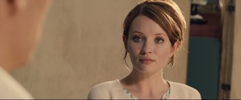 Movie still from “Legend” (2015), directed by Brian Helgeland – A person wearing a white shirt; Close Up shot, Over the shoulder angle