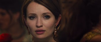 Movie still from “Legend” (2015), directed by Brian Helgeland – A person wearing earrings; Close Up shot, Over the shoulder angle