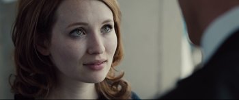 Movie still from “Legend” (2015), directed by Brian Helgeland – A woman's face with green eyes; Close Up shot, Over the shoulder angle
