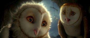Movie still from “Legend of the Guardians: The Owls of Ga'Hoole” (2010), directed by Zack Snyder – Two stuffed owls are sitting next to each other; Close Up shot, Low angle