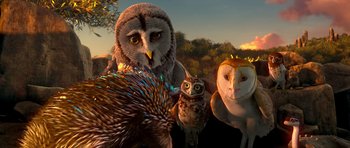 Movie still from “Legend of the Guardians: The Owls of Ga'Hoole” (2010), directed by Zack Snyder – A group of owls standing next to each other on a field; Wide shot, High angle
