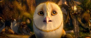 Movie still from “Legend of the Guardians: The Owls of Ga'Hoole” (2010), directed by Zack Snyder – An owl is looking at the camera in the woods; Close Up shot, High angle