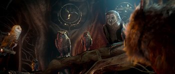 Movie still from “Legend of the Guardians: The Owls of Ga'Hoole” (2010), directed by Zack Snyder – A group of owls sitting on top of a tree branch; Wide shot, Low angle