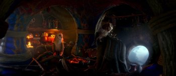 Movie still from “Legend of the Guardians: The Owls of Ga'Hoole” (2010), directed by Zack Snyder – A monkey sitting on top of an elephant in a dark room; Wide shot, High angle